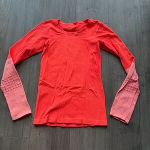 EUC Alo Yoga Exhale long sleeve top in neon orange/light pink